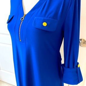 Beautiful wrinkle free and stretchy cobalt blue dress with gold accents.